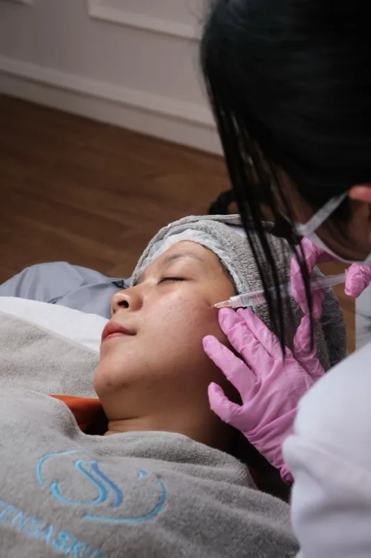 Licensed provider administering a medical aesthetic treatment at Tryst
